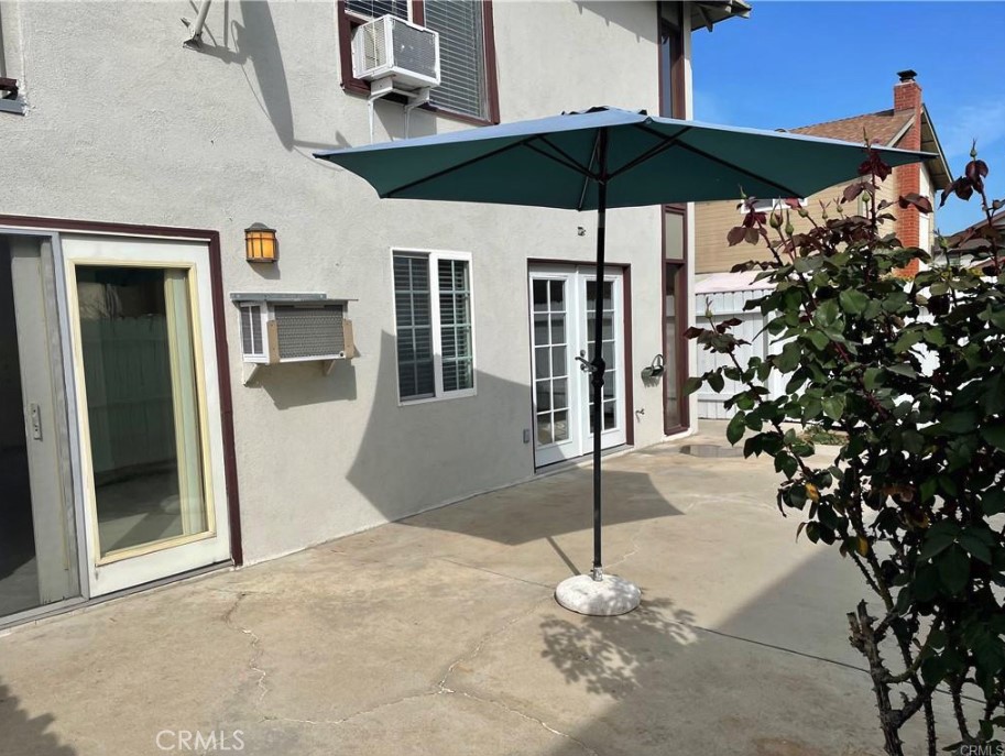 3217 Topaz Lane Fullerton, CA 92831 - Photo 17 of 23 a view of a chairs and table under an umbrella in front of house