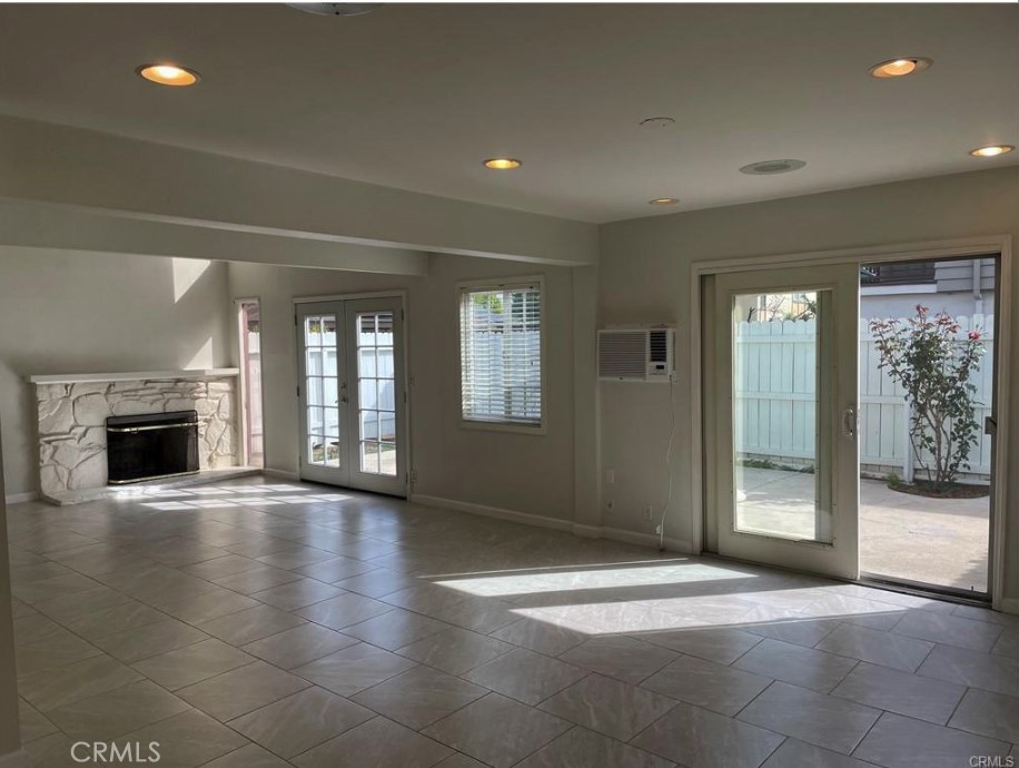 3217 Topaz Lane Fullerton, CA 92831 - Photo 7 of 23 a view of an empty room with a fireplace and a window