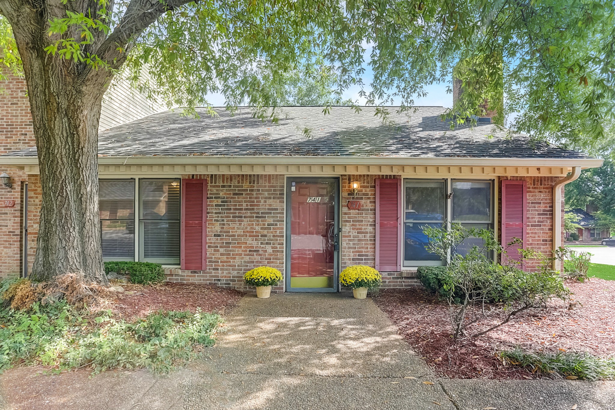 741 Kent Road Nashville, TN 37214 - Photo 1 of 25 a front view of a house with garden