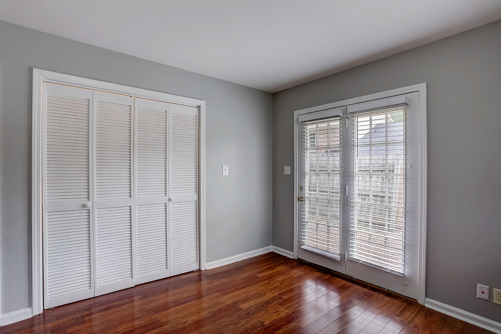 741 Kent Road Nashville, TN 37214 - Photo 11 of 25 a view of an empty room with wooden floor and a window