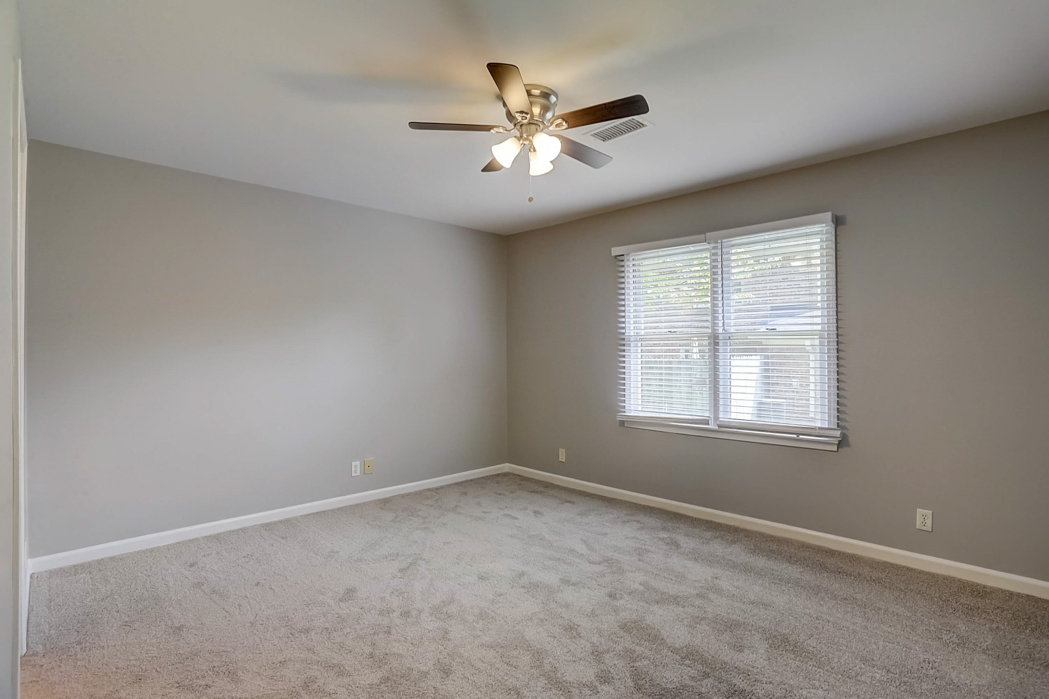 741 Kent Road Nashville, TN 37214 - Photo 13 of 25 an empty room with a window and a fan