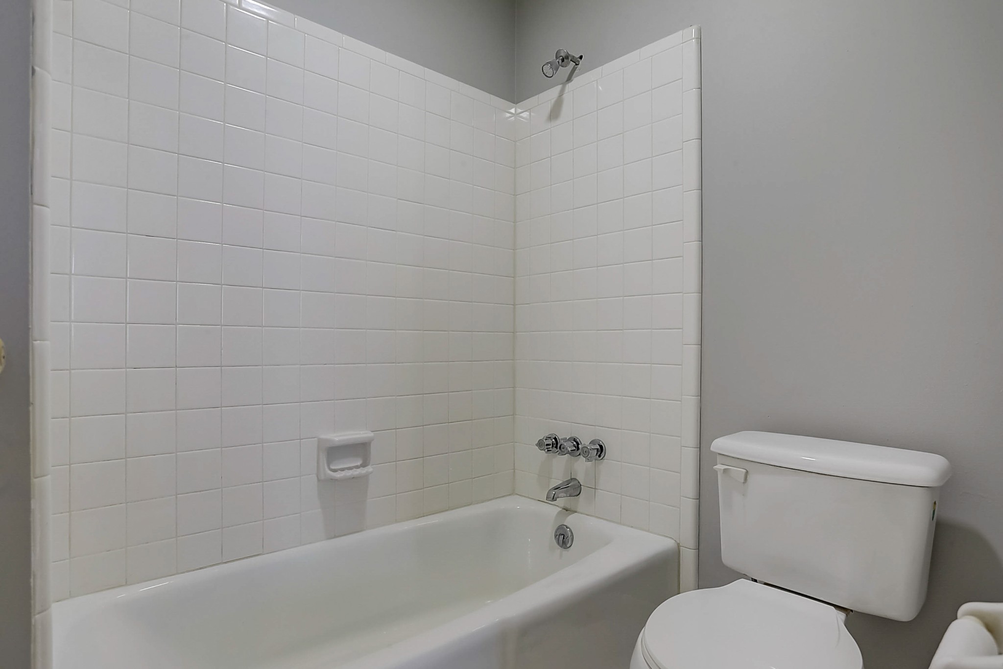 741 Kent Road Nashville, TN 37214 - Photo 16 of 25 a white toilet sitting next to a bath tub