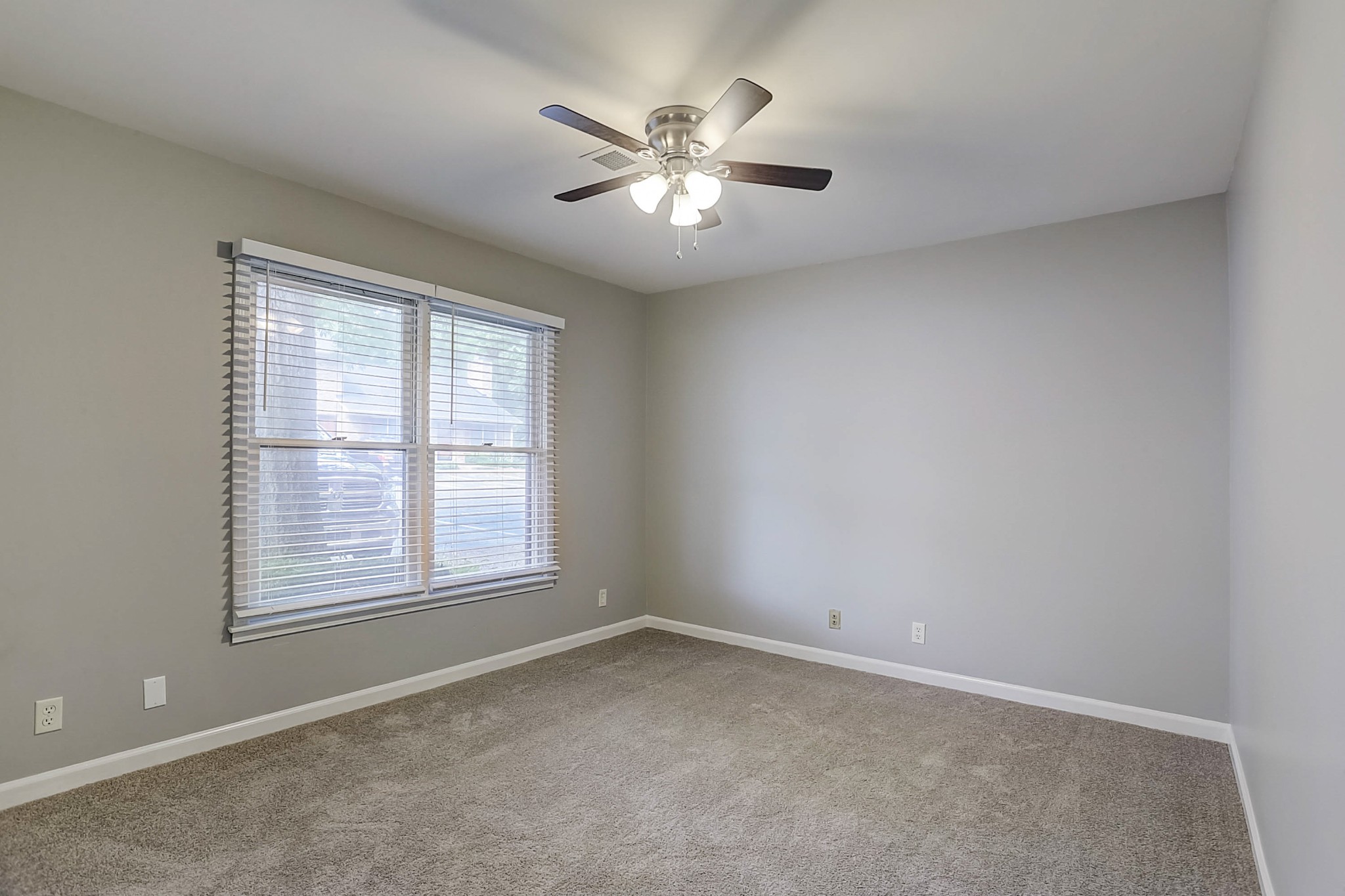 741 Kent Road Nashville, TN 37214 - Photo 18 of 25 an empty room with chandelier fan and windows