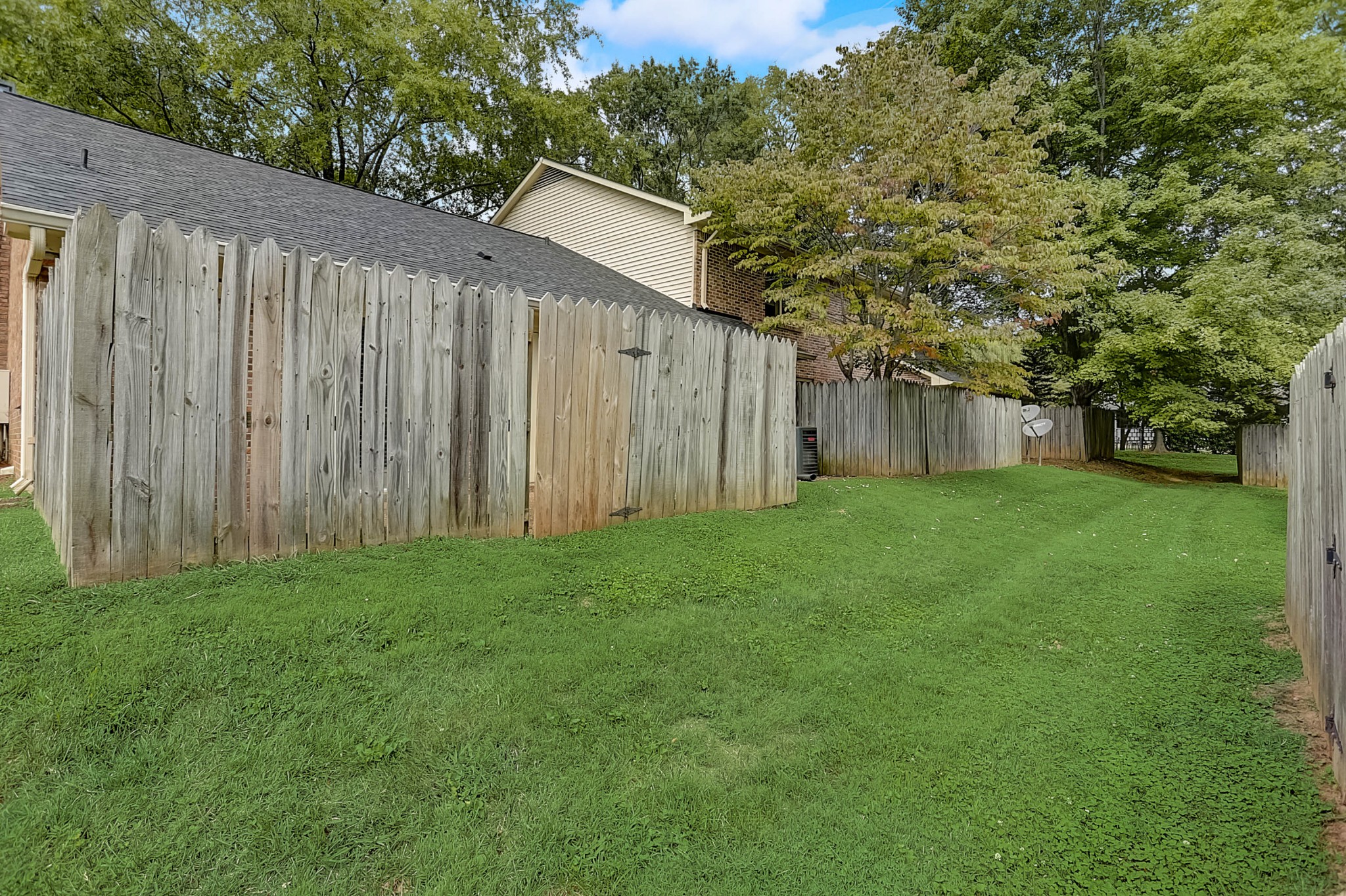 741 Kent Road Nashville, TN 37214 - Photo 25 of 25 a view of a backyard with potted plants and large tree