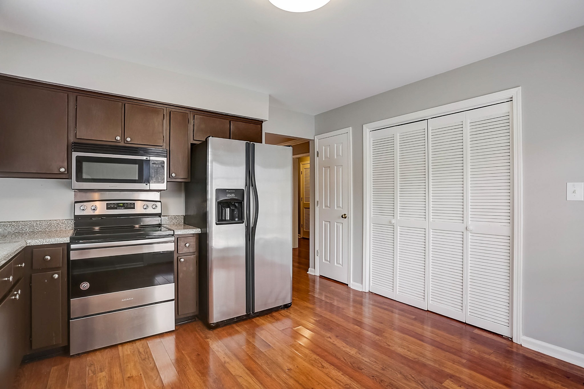 741 Kent Road Nashville, TN 37214 - Photo 9 of 25 a kitchen with granite countertop stainless steel appliances a refrigerator and cabinets
