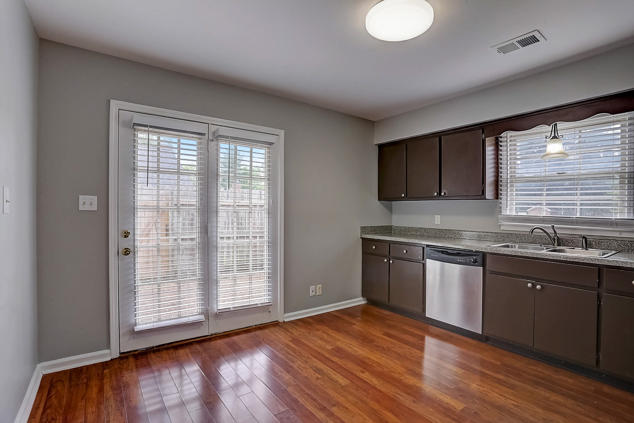 741 Kent Road Nashville, TN 37214 - Photo 10 of 25 a kitchen with stainless steel appliances granite countertop a sink a stove a refrigerator and cabinets