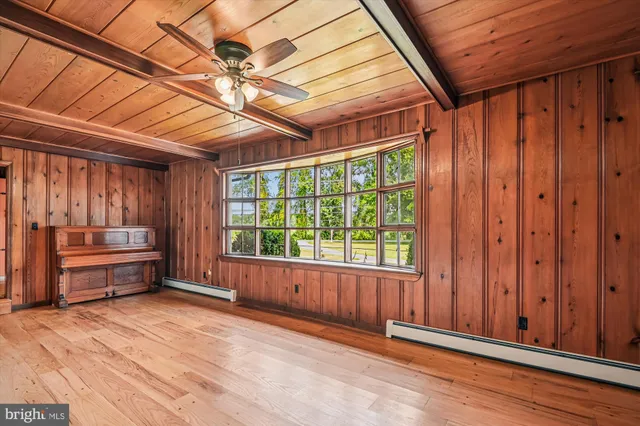 a kitchen with stainless steel appliances granite countertop a stove a sink and a large window