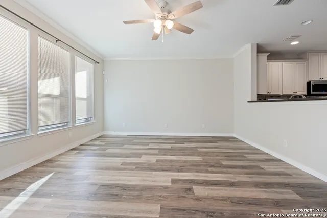 a view of a kitchen with a sink and a window