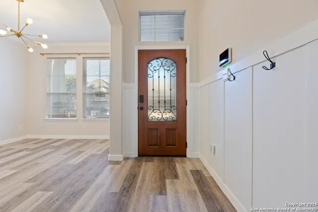 a view of an entryway with wooden floor