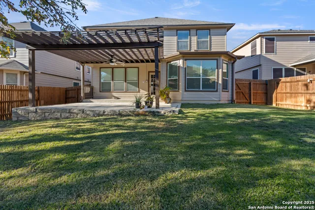a large house with a large pool table and chairs