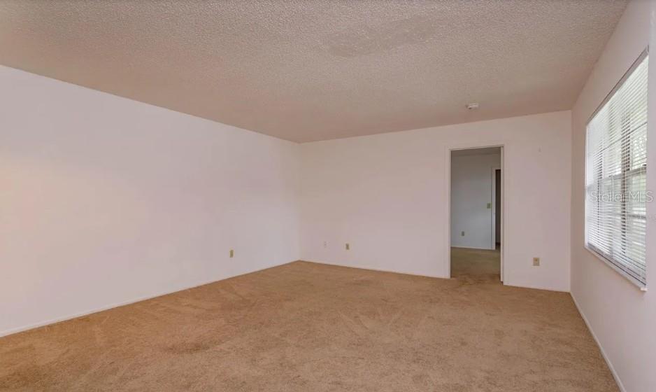 68 Windtree Lane, Unit 201 Winter Garden, FL 34787 - Photo 12 of 23 an empty room with windows