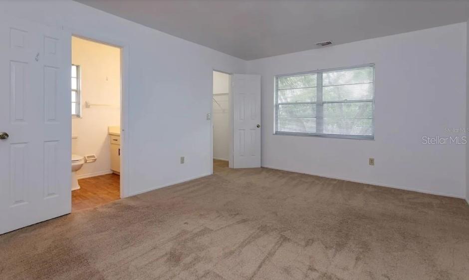 68 Windtree Lane, Unit 201 Winter Garden, FL 34787 - Photo 15 of 23 an empty room with windows