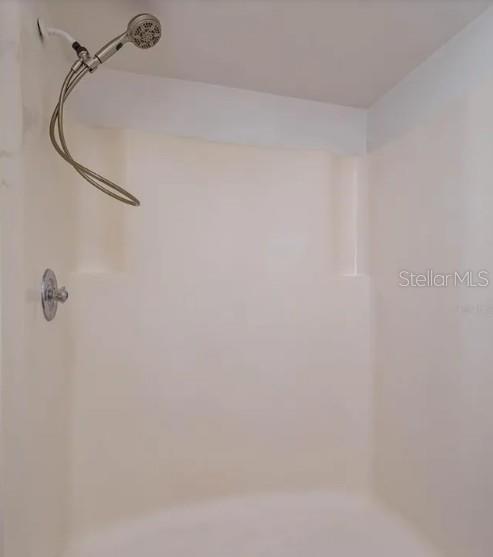 68 Windtree Lane, Unit 201 Winter Garden, FL 34787 - Photo 19 of 23 a bathroom with a shower