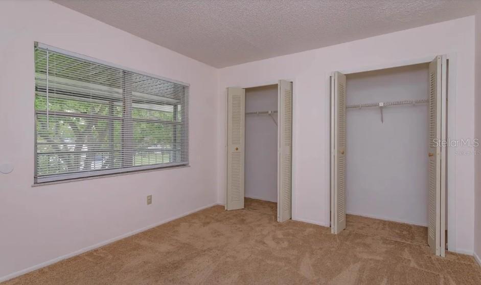 68 Windtree Lane, Unit 201 Winter Garden, FL 34787 - Photo 20 of 23 a view of an empty room with a window