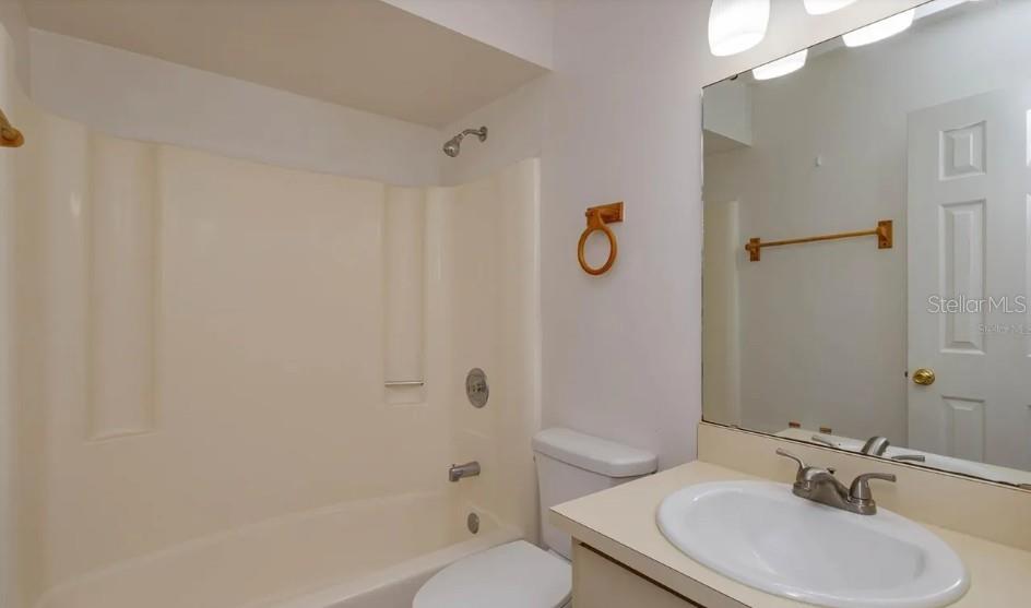 68 Windtree Lane, Unit 201 Winter Garden, FL 34787 - Photo 21 of 23 a bathroom with a sink toilet and shower