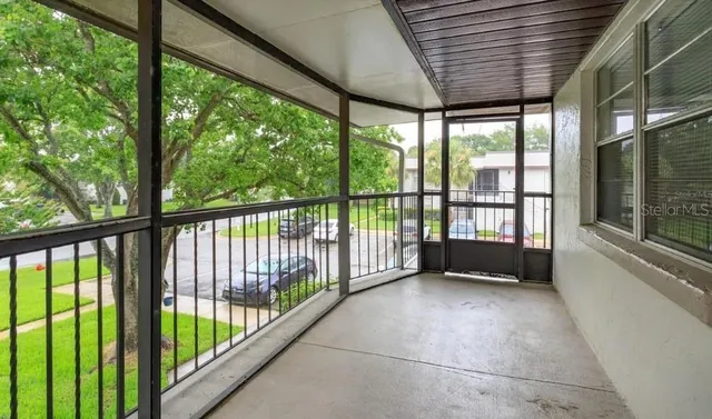 a view of outdoor room with a large window