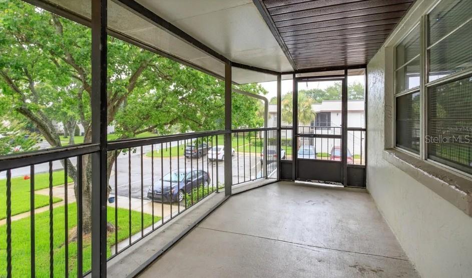 68 Windtree Lane, Unit 201 Winter Garden, FL 34787 - Photo 3 of 23 a view of outdoor room with a large window