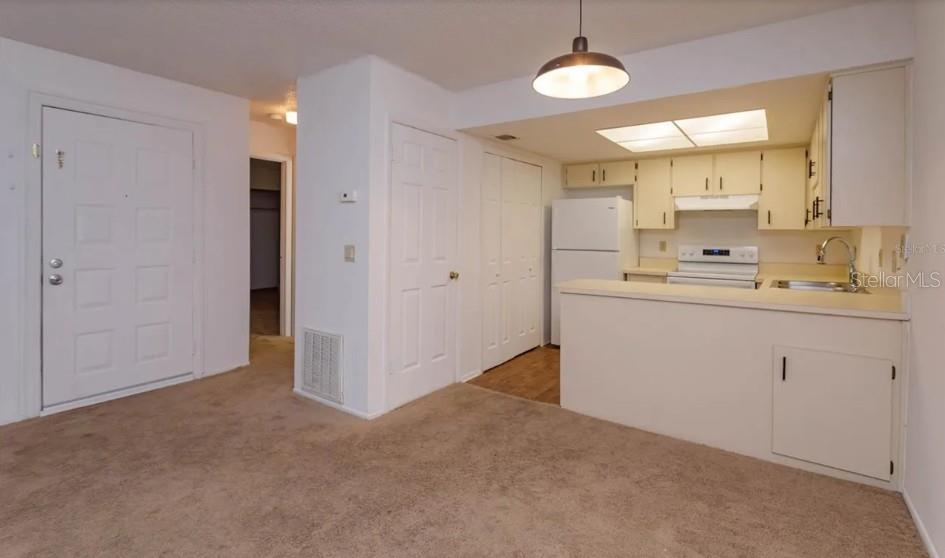 68 Windtree Lane, Unit 201 Winter Garden, FL 34787 - Photo 7 of 23 a view of a kitchen with a sink