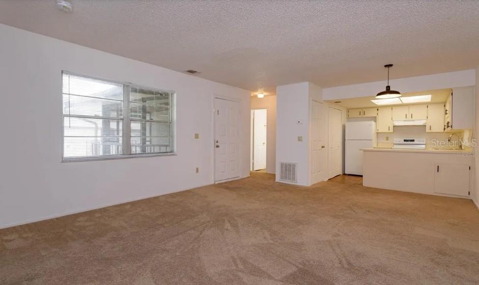 68 Windtree Lane, Unit 201 Winter Garden, FL 34787 - Photo 10 of 23 a view of an empty room with a window