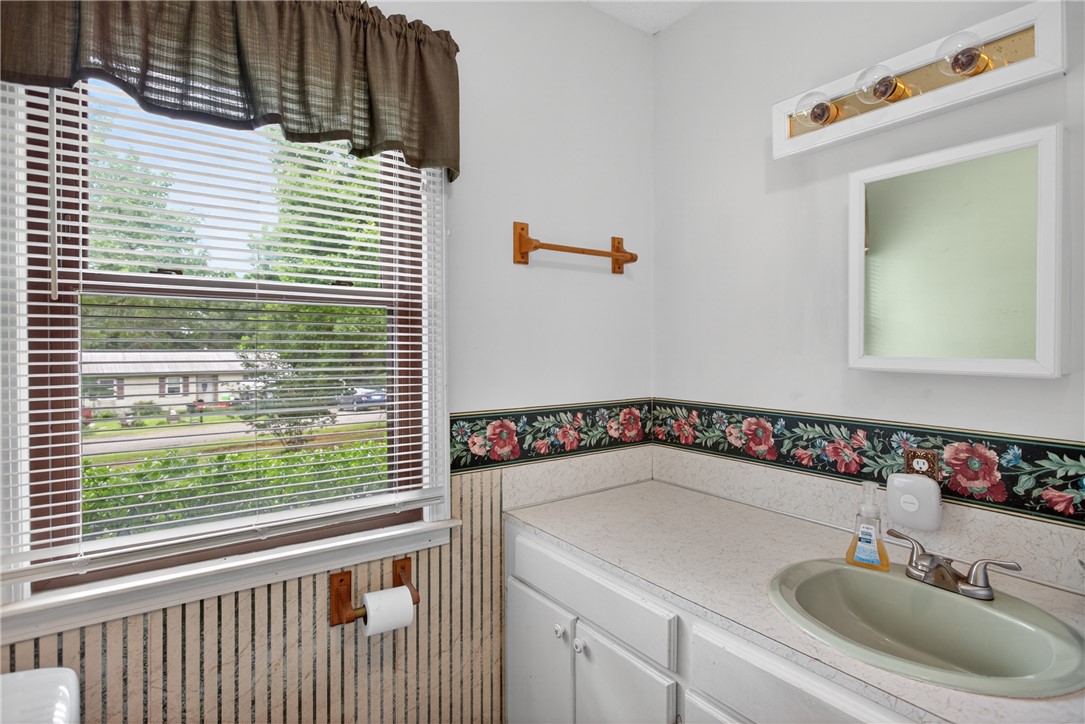 112 Holliday Lane Pendleton, SC 29670 - Photo 28 of 42 A well-lit bathroom with a bright window, offering a view of the surrounding neighborhood.
