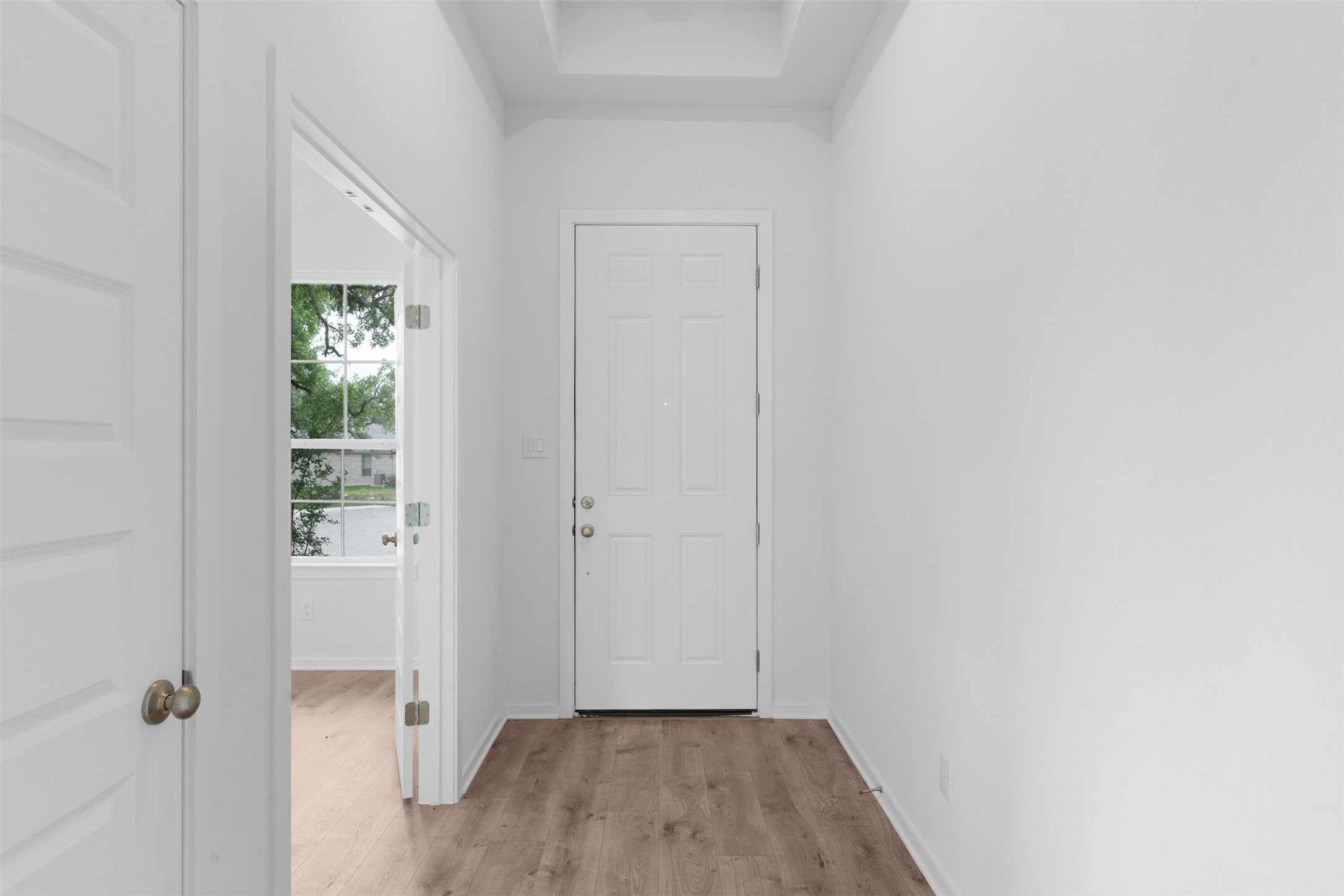 316 Ridgewell Loop Georgetown, TX 78633 - Photo 9 of 25 a view of a hallway with wooden floor and closet