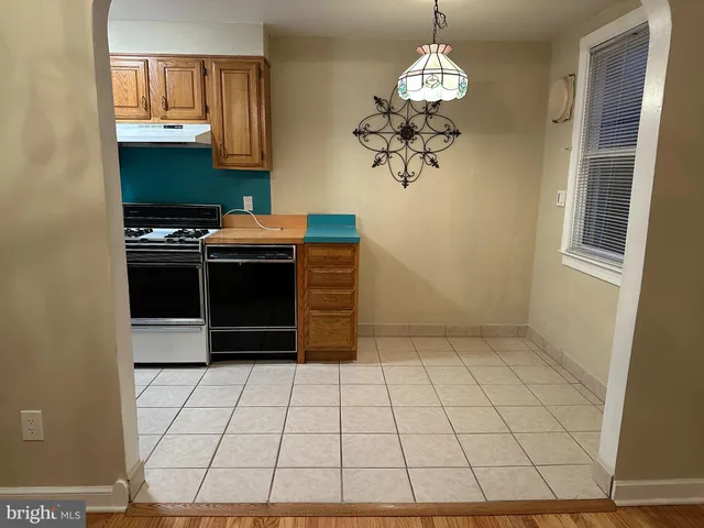 a kitchen with stainless steel appliances a stove a sink and a microwave