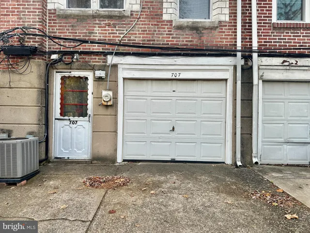 a view of a yard with trees in the background