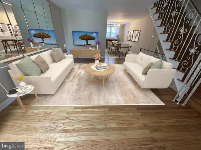 a living room with furniture and a table