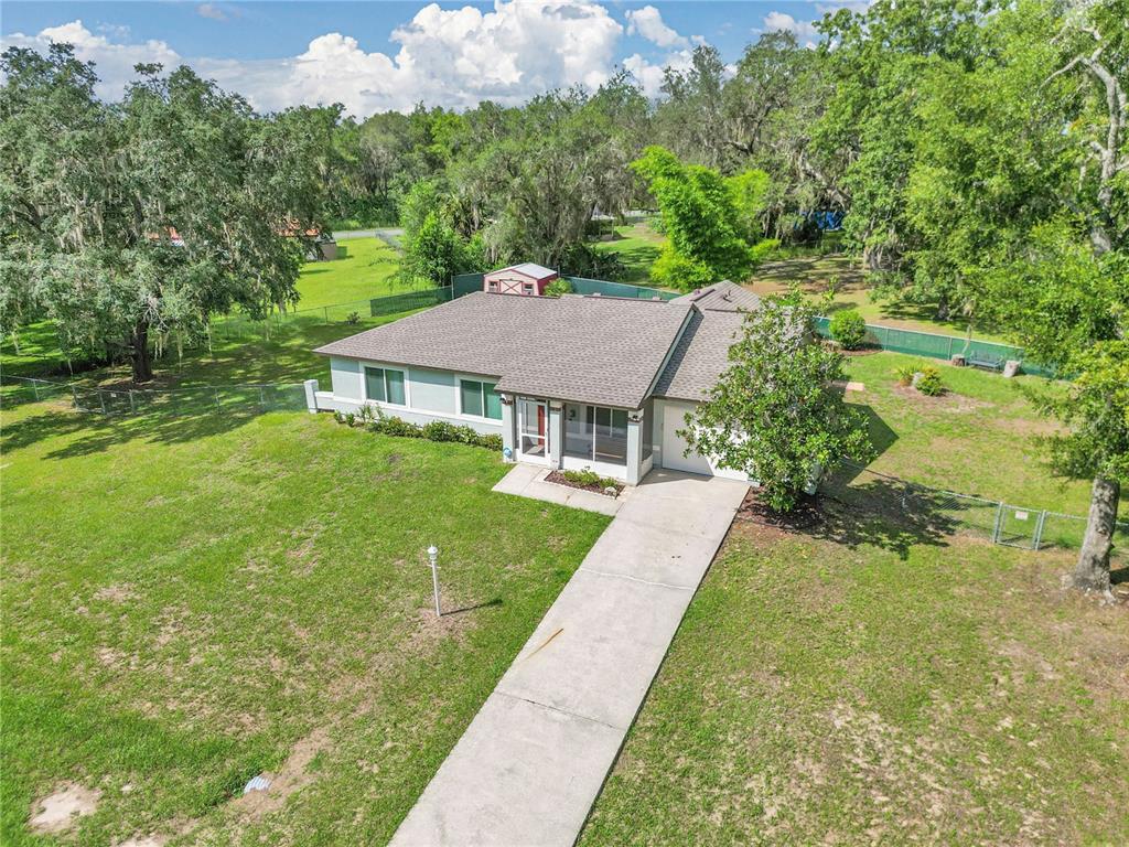814 Oak Road Ocala, FL 34472 - Photo 14 of 52 a aerial view of a house with a yard table and chairs