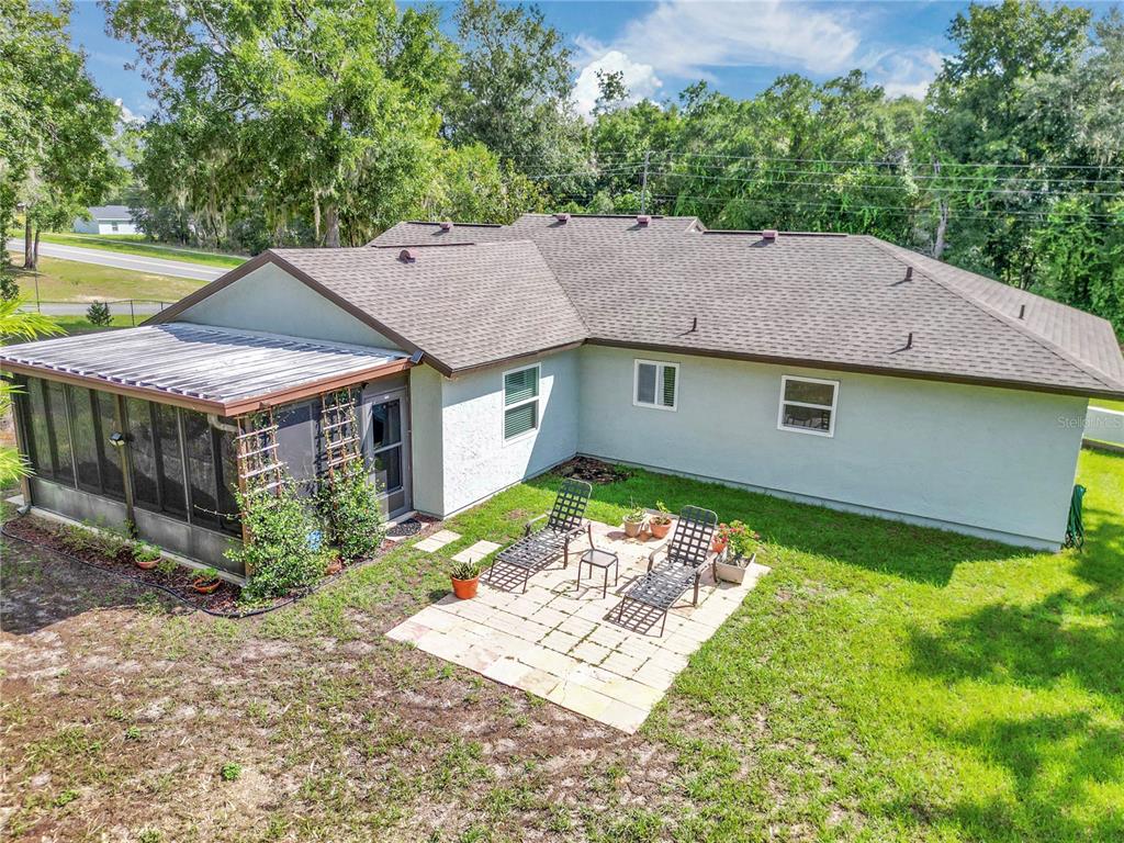 814 Oak Road Ocala, FL 34472 - Photo 16 of 52 a aerial view of a house with a yard table and chairs