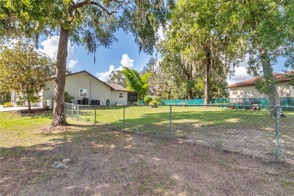 814 Oak Road Ocala, FL 34472 - Photo 20 of 52 a view of yard with swimming pool and yard