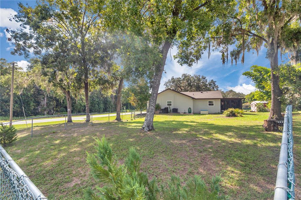 814 Oak Road Ocala, FL 34472 - Photo 21 of 52 a view of a house with a yard