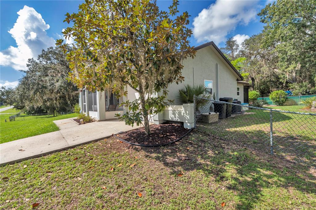 814 Oak Road Ocala, FL 34472 - Photo 22 of 52 a view of a house with backyard and sitting area