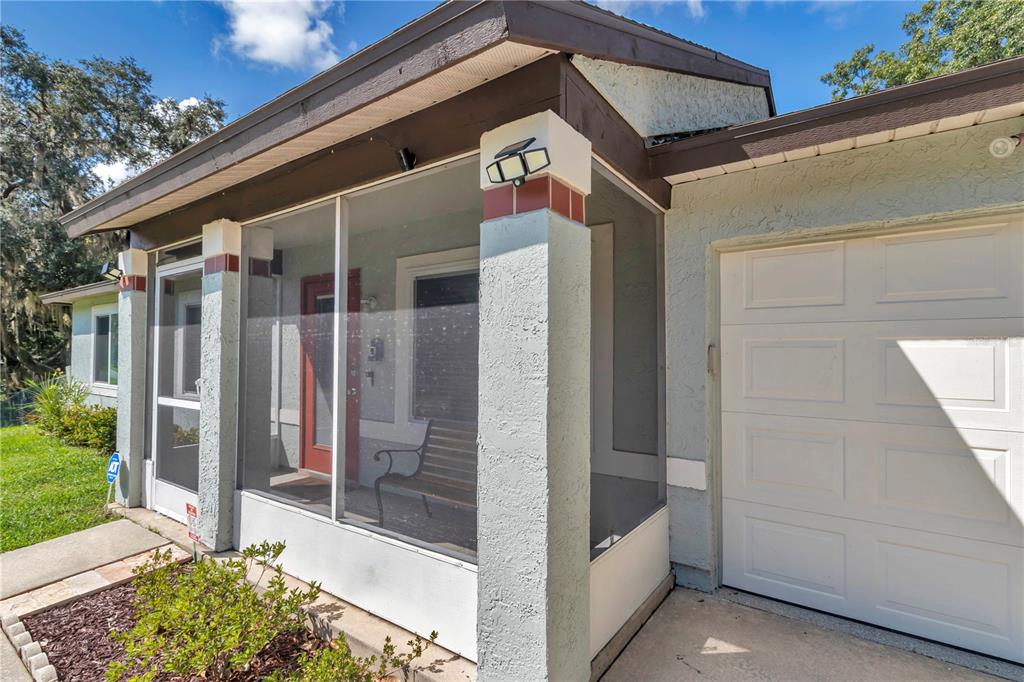814 Oak Road Ocala, FL 34472 - Photo 23 of 52 a front view of a house with a glass door