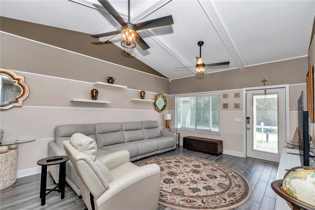 814 Oak Road Ocala, FL 34472 - Photo 30 of 52 a living room with furniture ceiling fan and a rug