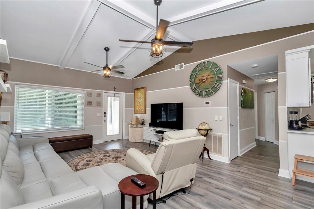 814 Oak Road Ocala, FL 34472 - Photo 31 of 52 a living room with furniture a fireplace and a flat screen tv