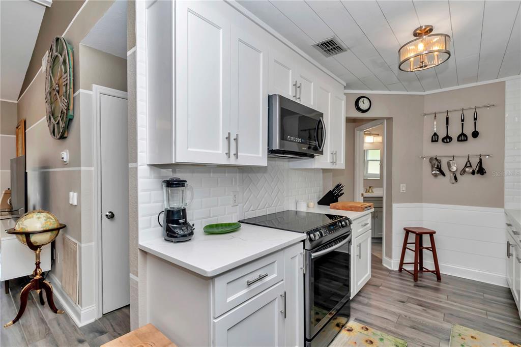 814 Oak Road Ocala, FL 34472 - Photo 34 of 52 a kitchen with stainless steel appliances granite countertop a stove and a microwave