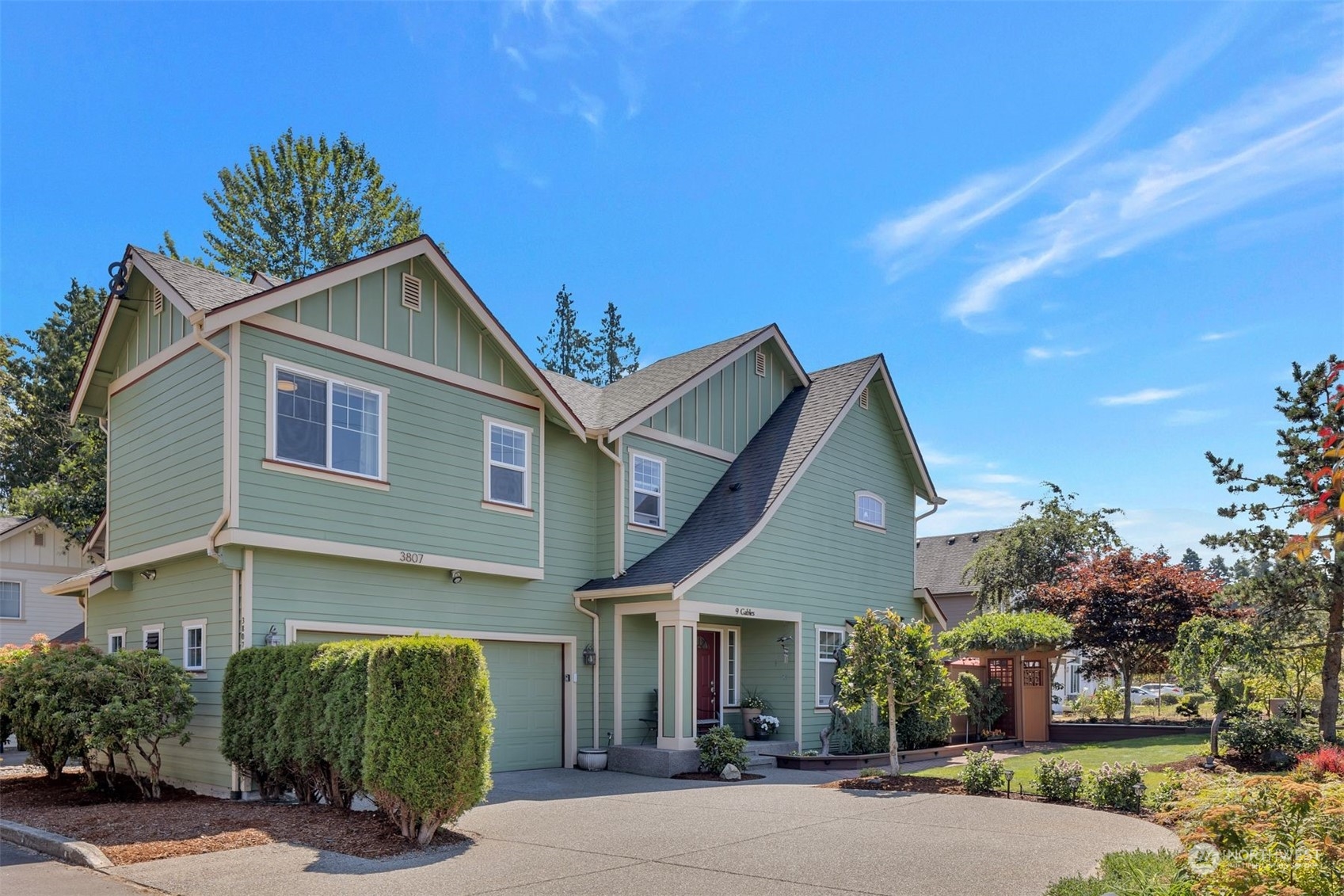 3807 Northeast 14th Street Renton, WA 98056 - Photo 1 of 34 a front view of a house with a yard