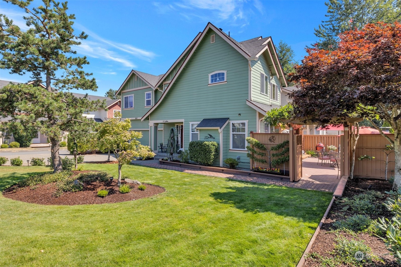 3807 Northeast 14th Street Renton, WA 98056 - Photo 12 of 34 a front view of a house with a yard table and chairs
