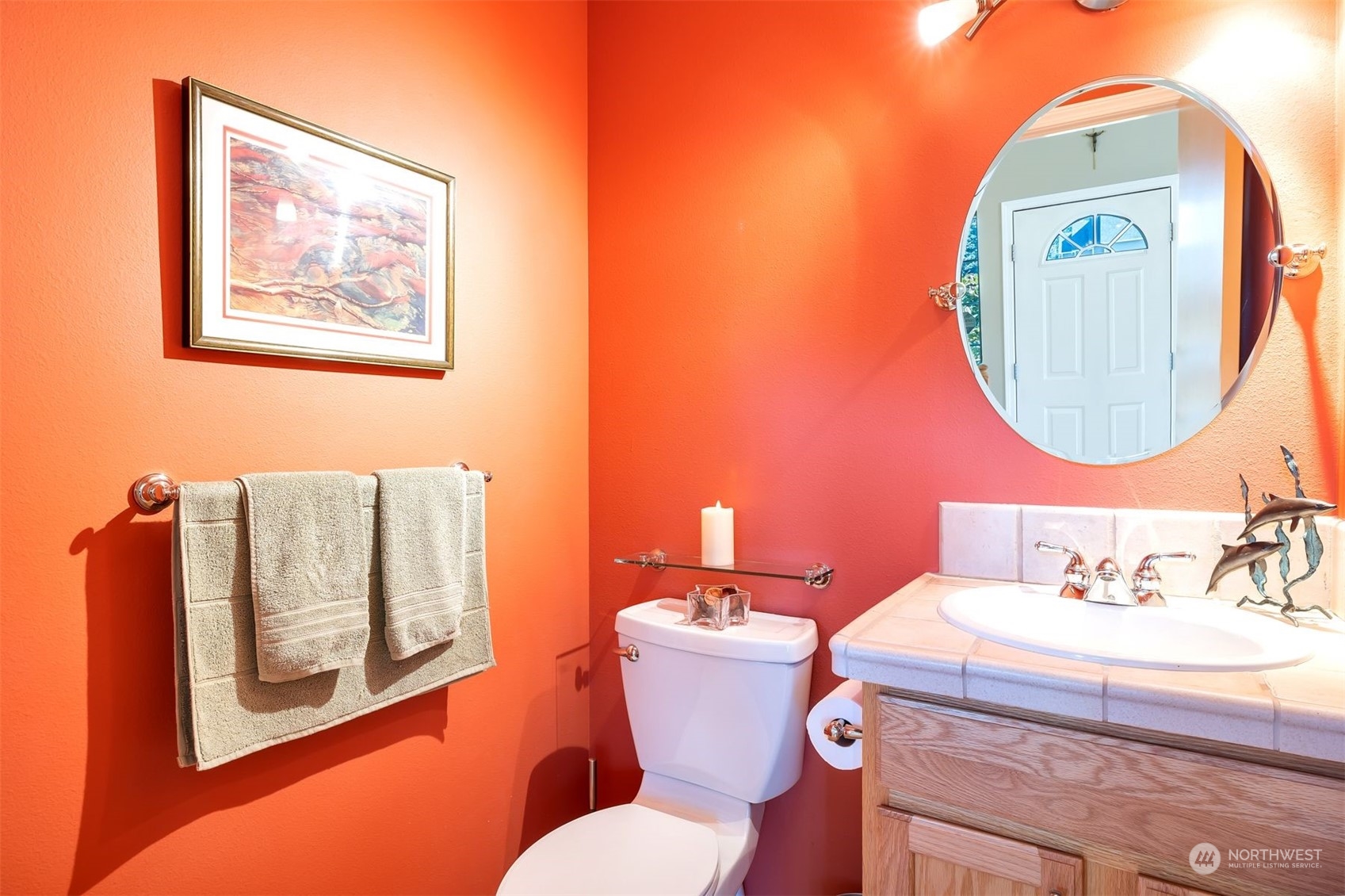 3807 Northeast 14th Street Renton, WA 98056 - Photo 15 of 34 a bathroom with a toilet a sink and a mirror