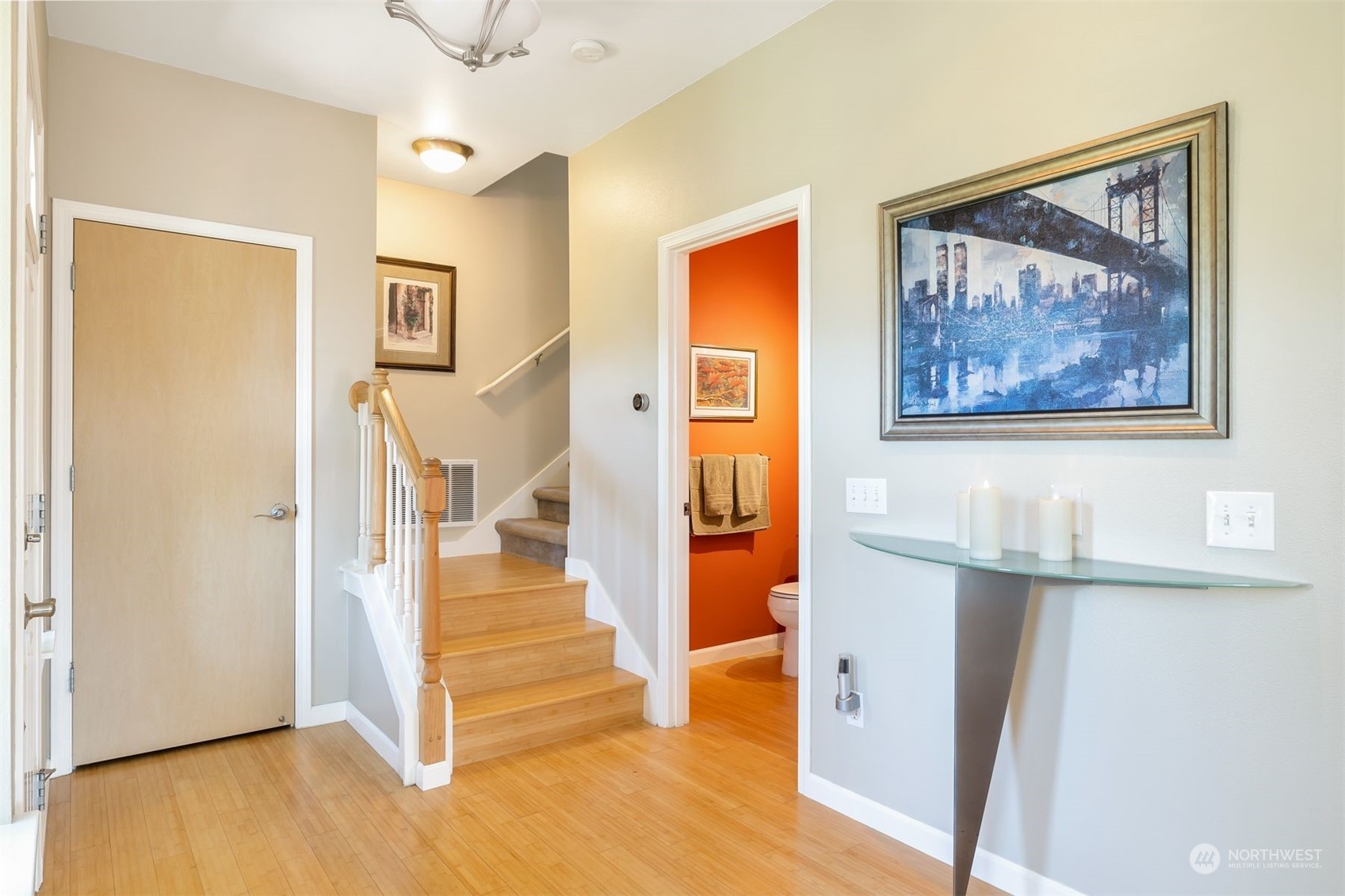 3807 Northeast 14th Street Renton, WA 98056 - Photo 2 of 34 a view of a hallway with wooden floor and cabinet