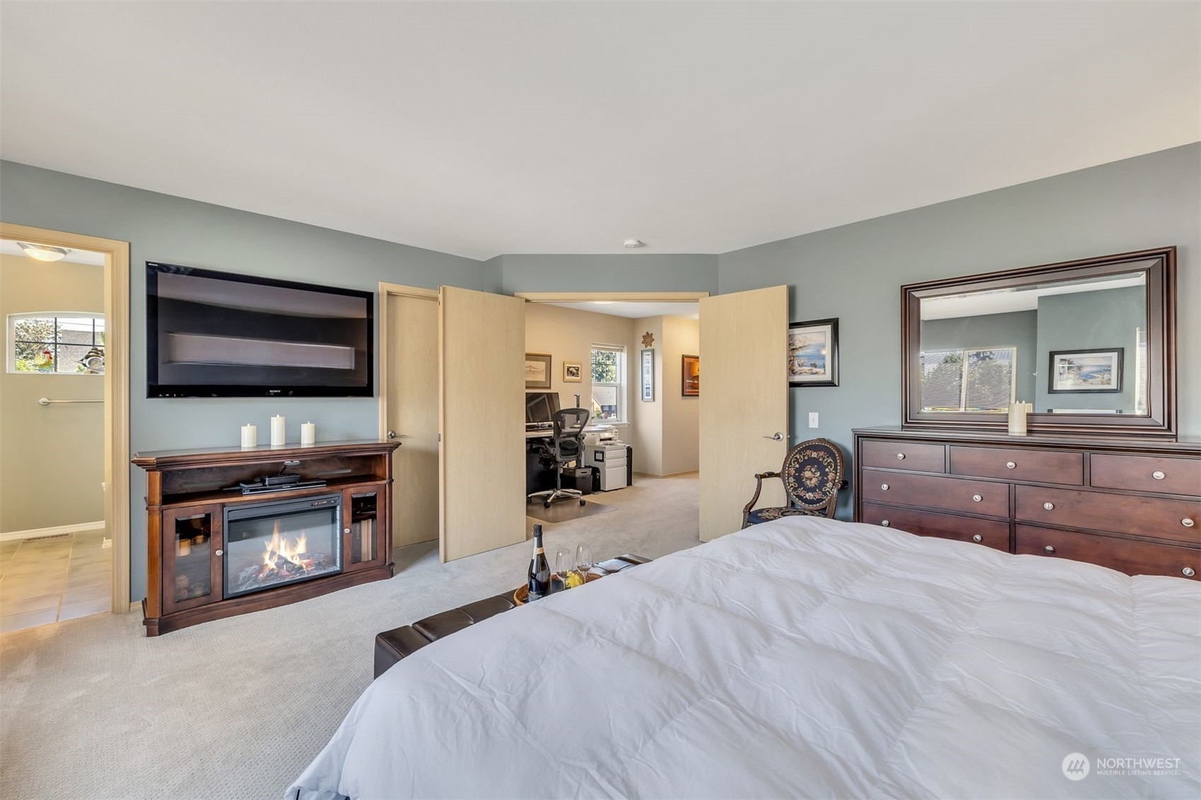 3807 Northeast 14th Street Renton, WA 98056 - Photo 21 of 34 a bedroom with a bed and a flat screen tv