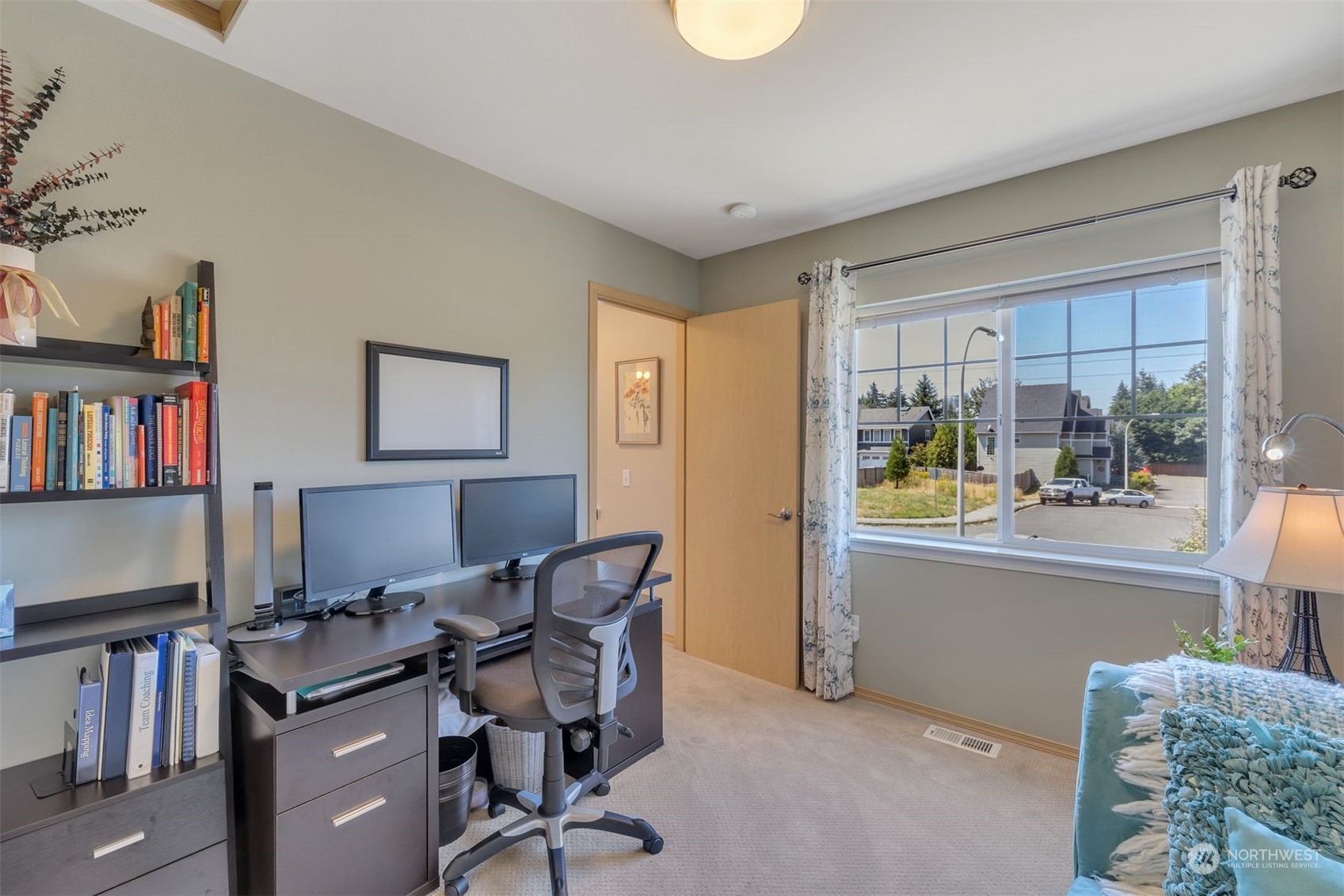 3807 Northeast 14th Street Renton, WA 98056 - Photo 22 of 34 a view of a workspace with furniture and a window