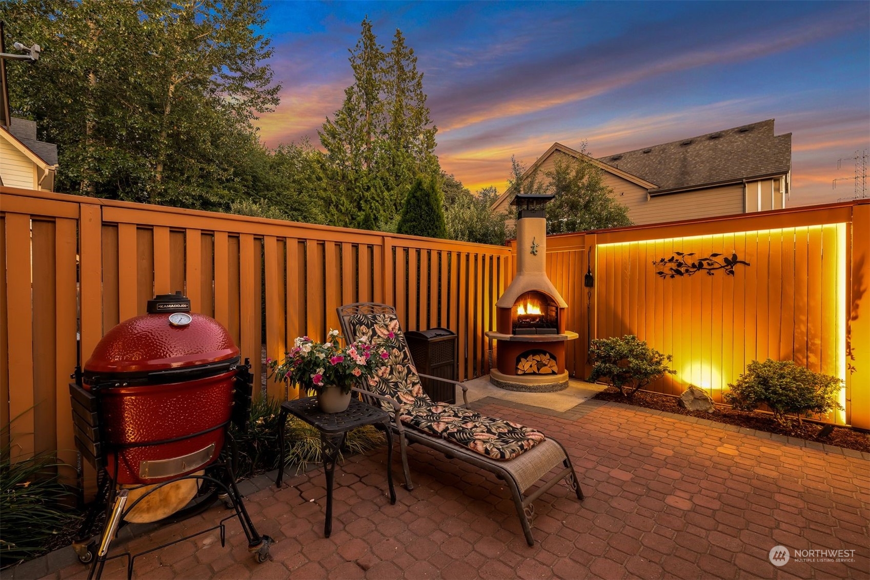 3807 Northeast 14th Street Renton, WA 98056 - Photo 26 of 34 a view of a chair and tables in the back yard of the house