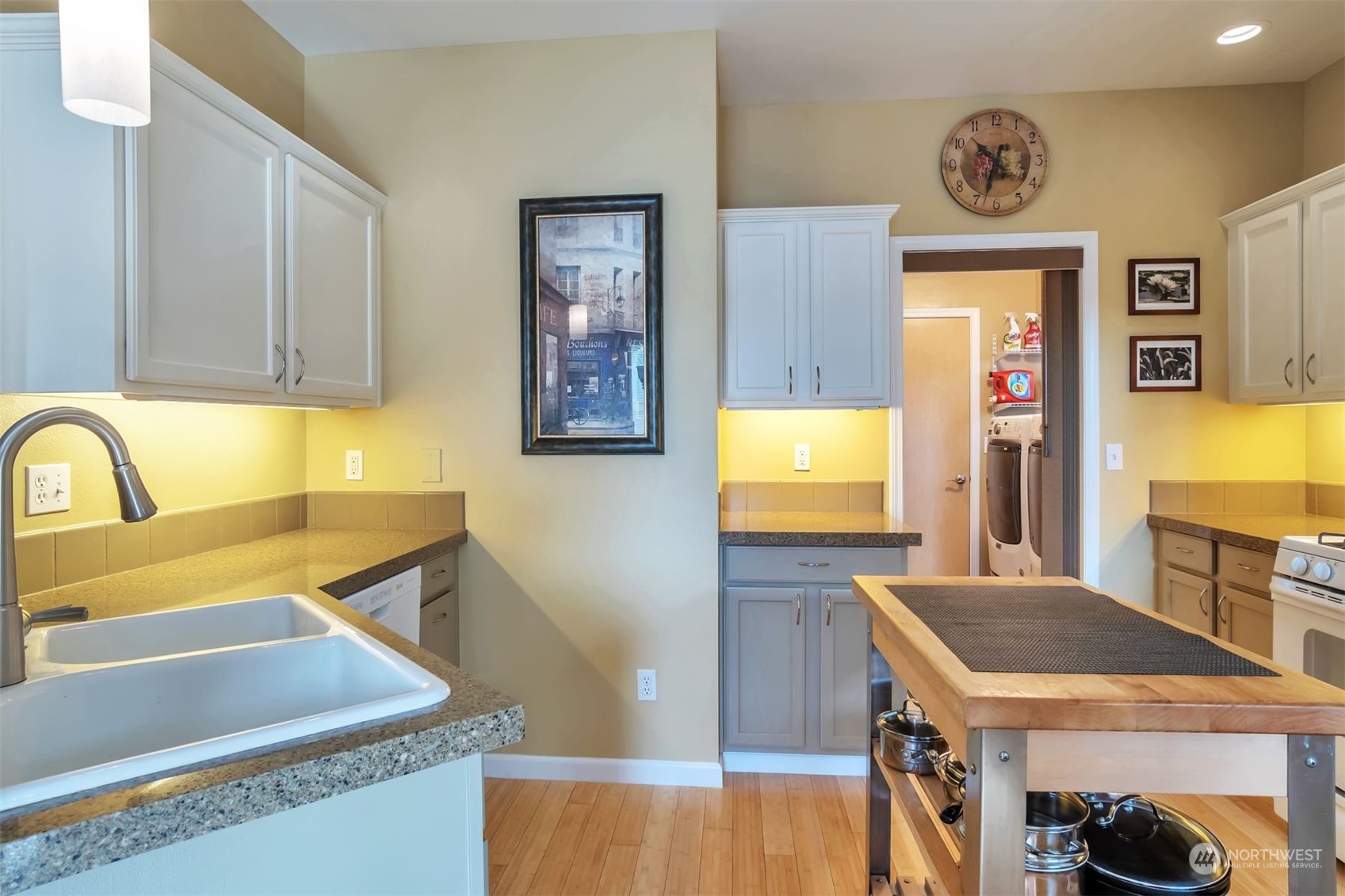 3807 Northeast 14th Street Renton, WA 98056 - Photo 7 of 34 a kitchen with stainless steel appliances granite countertop a sink a stove and a refrigerator
