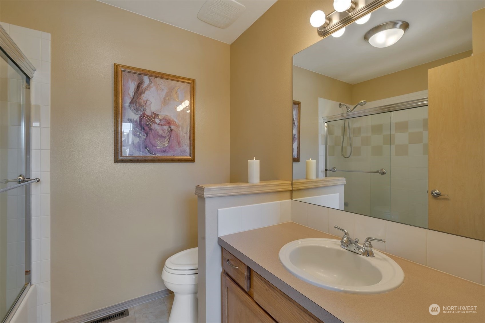 3807 Northeast 14th Street Renton, WA 98056 - Photo 10 of 34 a bathroom with a toilet sink and mirror