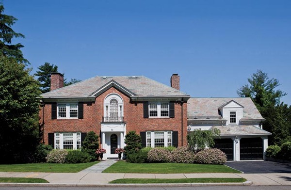 a front view of a house with a yard