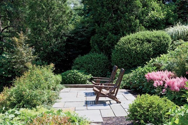 52 Oldham Road Newton, MA 02465 - Photo 10 of 11 an outdoor sitting area with a table and chairs