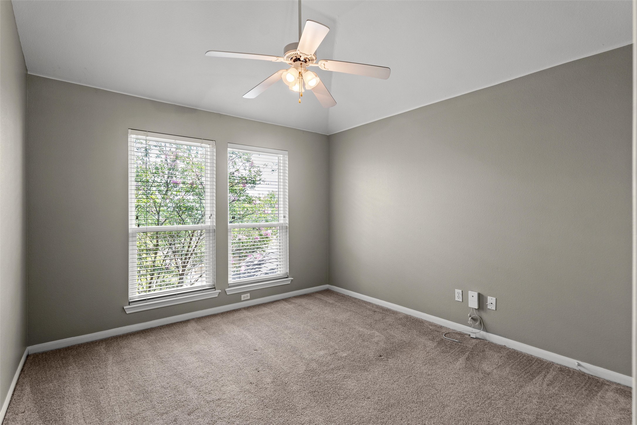 7000 Colberg Court Austin, TX 78749 - Photo 25 of 40 Third Bedroom has A comfortable bedroom with ample natural light, featuring a convenient ceiling fan for air circulation.