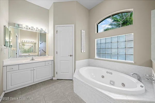 a bathroom with a bathtub and a sink